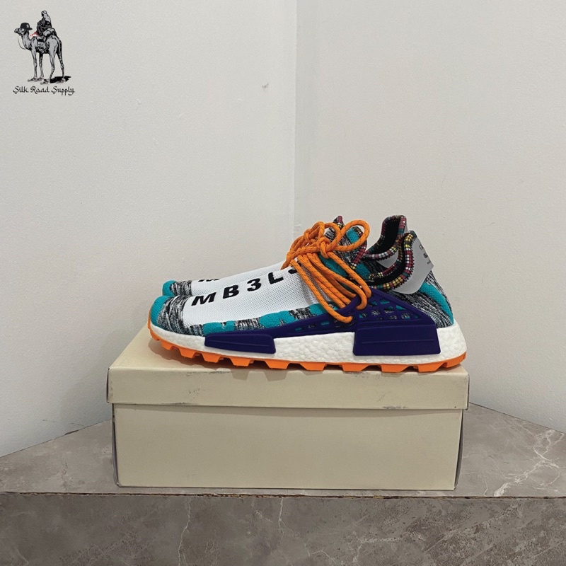 Nmd hu pharrell solar best sale pack orange