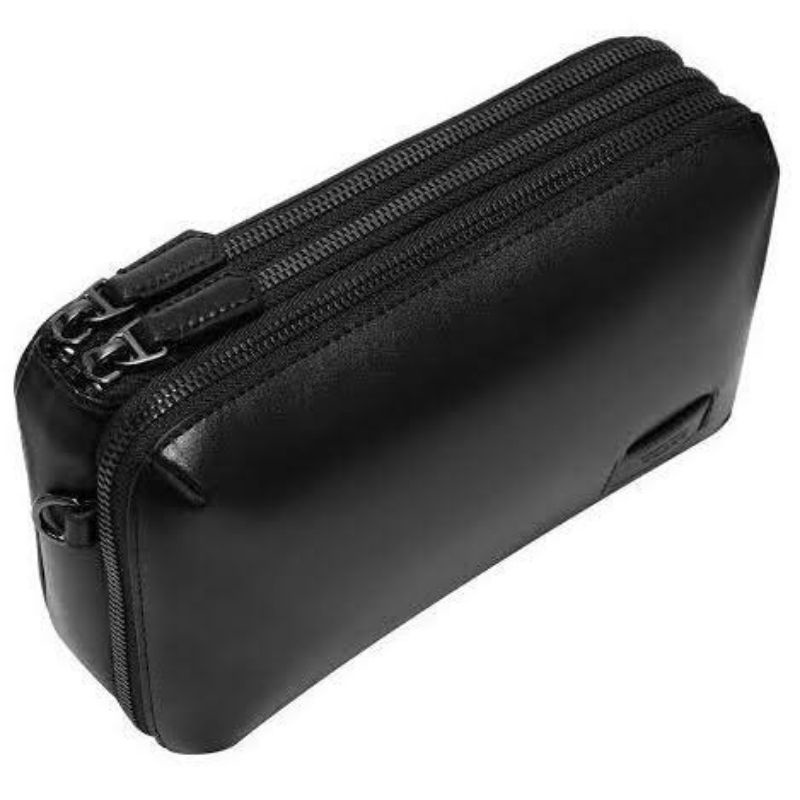 Tumi nassau best sale triple zip clutch