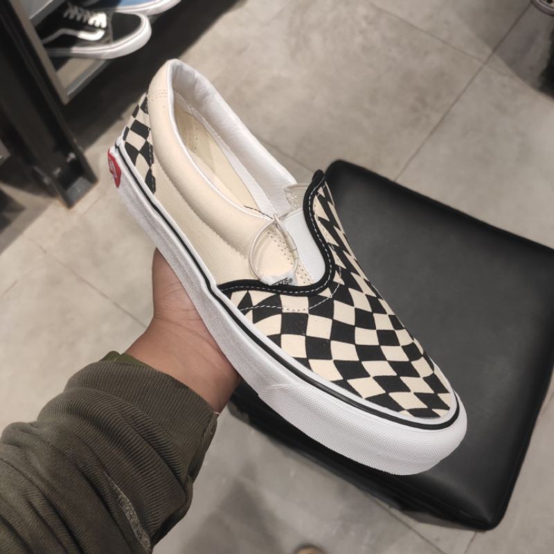 Jual vans slip hot sale on checkerboard